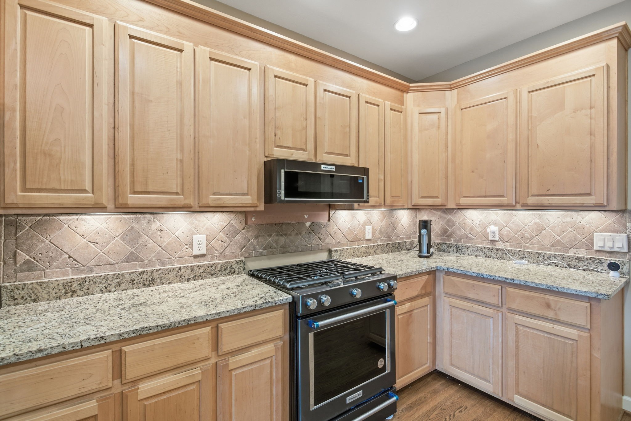 213 Bradshaw Road Lebanon, TN 37087 - Photo 18 of 65 a kitchen with granite countertop white cabinets and stainless steel appliances