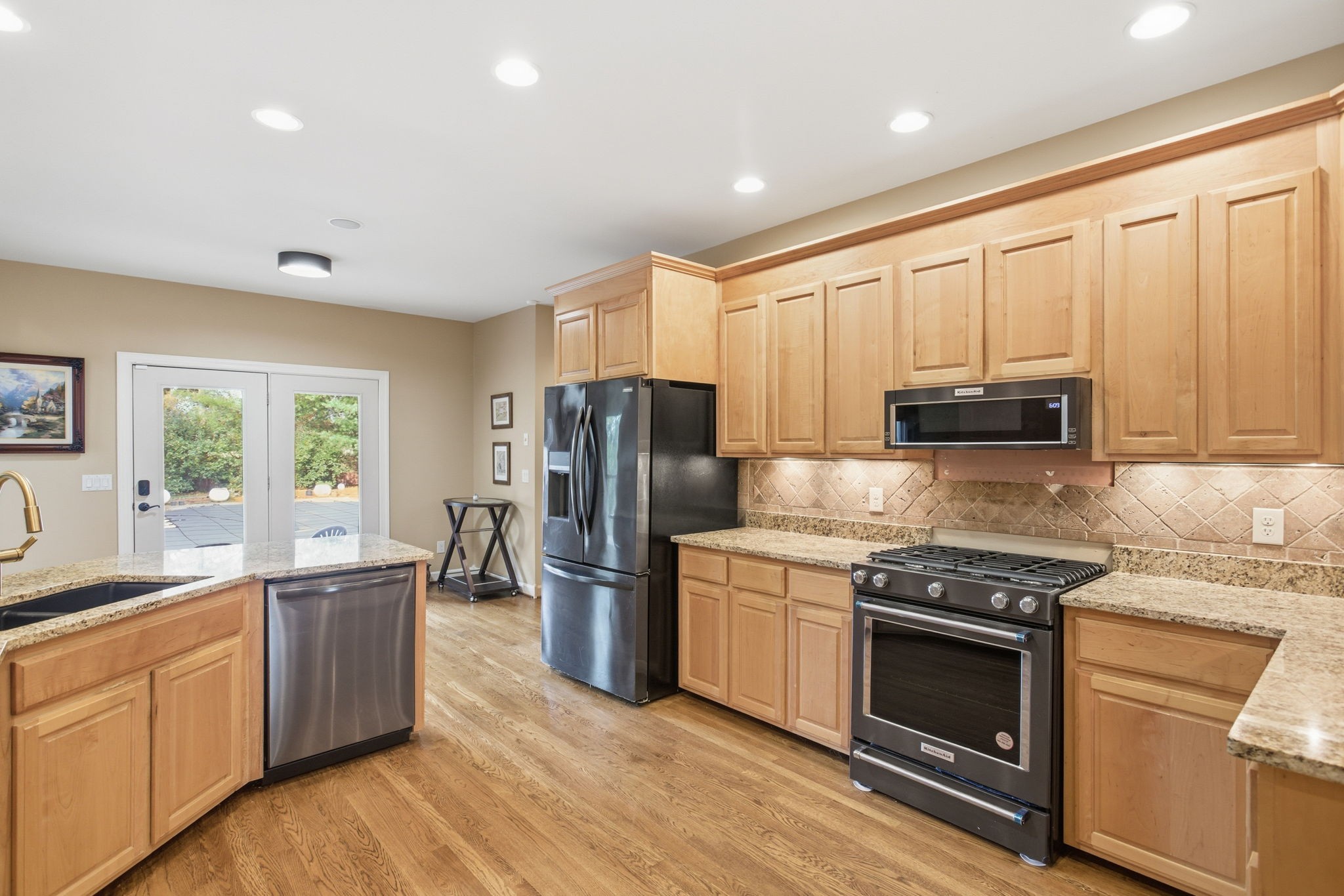 213 Bradshaw Road Lebanon, TN 37087 - Photo 20 of 65 a kitchen with stainless steel appliances granite countertop a refrigerator stove and sink