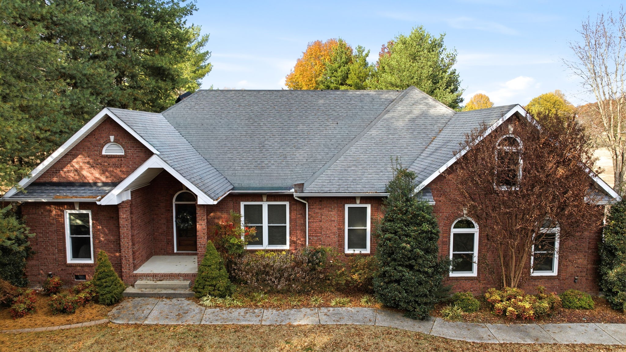 213 Bradshaw Road Lebanon, TN 37087 - Photo 2 of 65 a front view of a house with a yard and garage