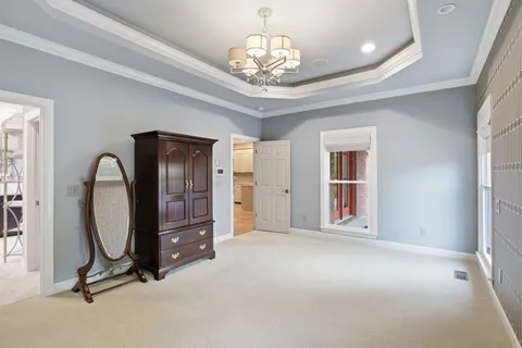 a bathroom with a double vanity sink a large mirror and shower