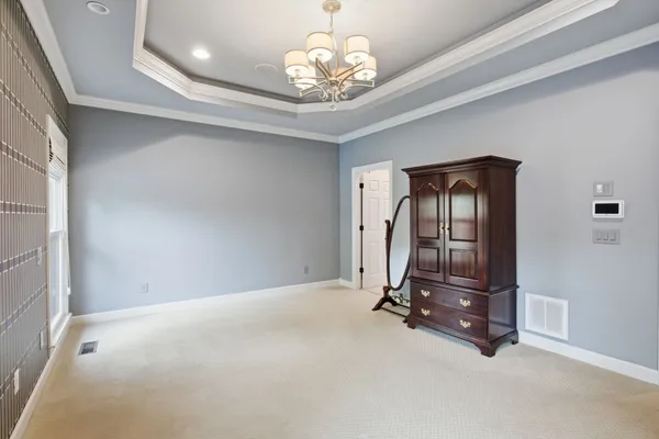 a view of a livingroom with furniture and a window