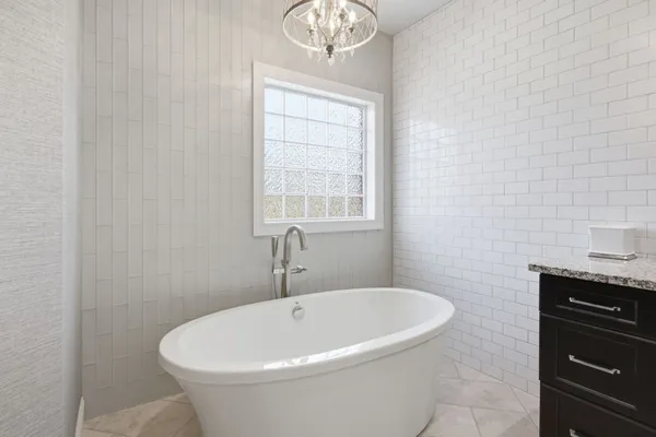 a utility room with sink dryer and washer