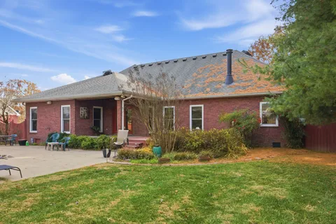 a bedroom with a bed and a table