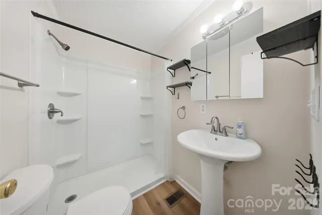 a bathroom with a sink toilet shower and bathtub