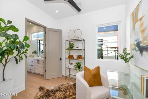 a bathroom with a granite countertop sink mirror and a shower