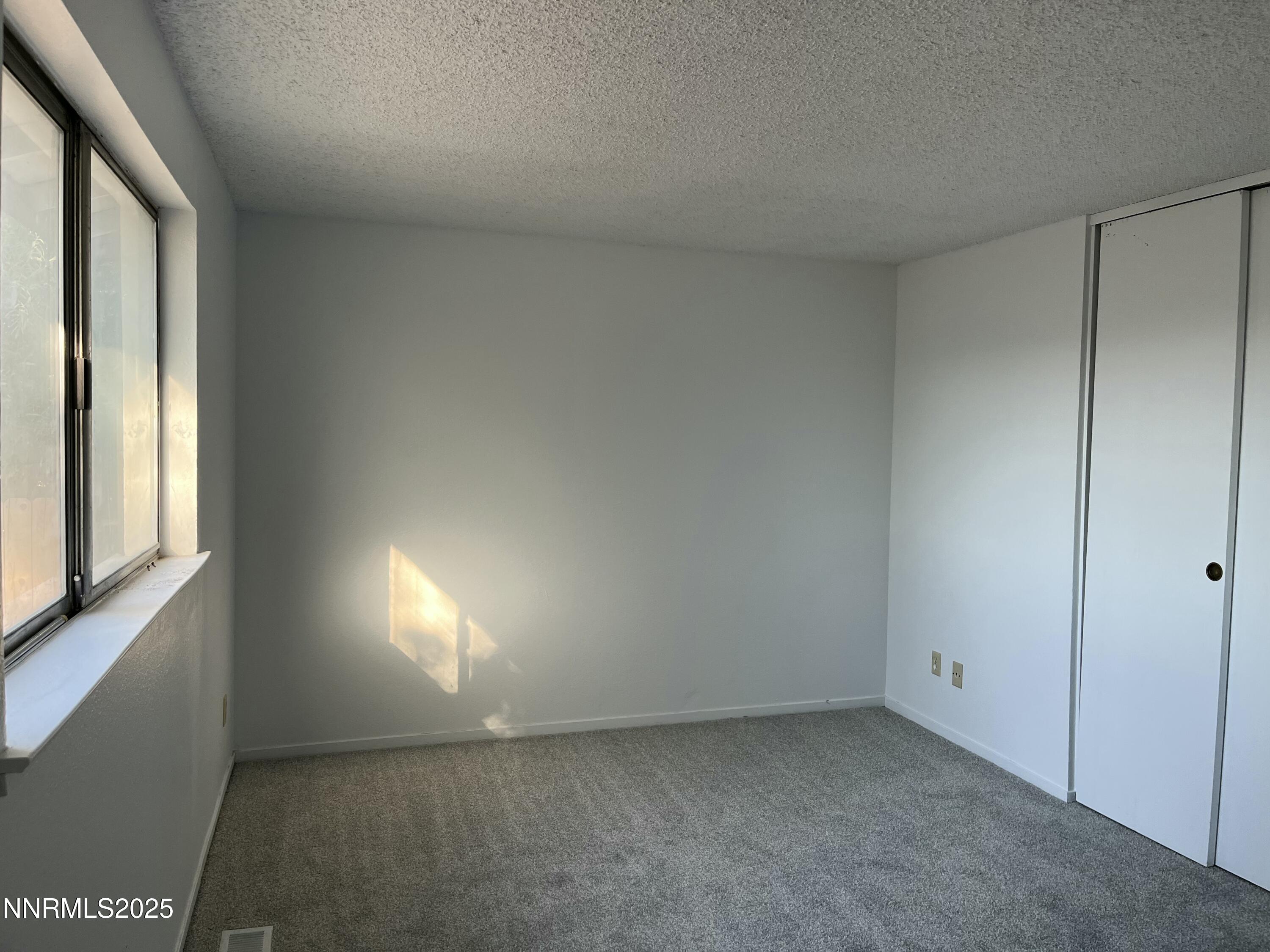 11019 Bornite Court Reno, NV 89506 - Photo 17 of 30 a view of an empty room and window