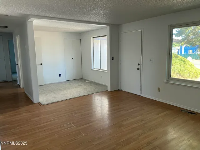 a view of a kitchen from a hallway