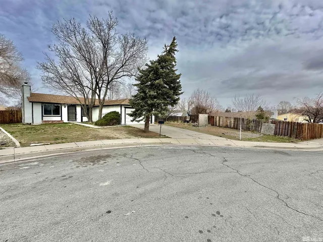 a view of road with building and trees
