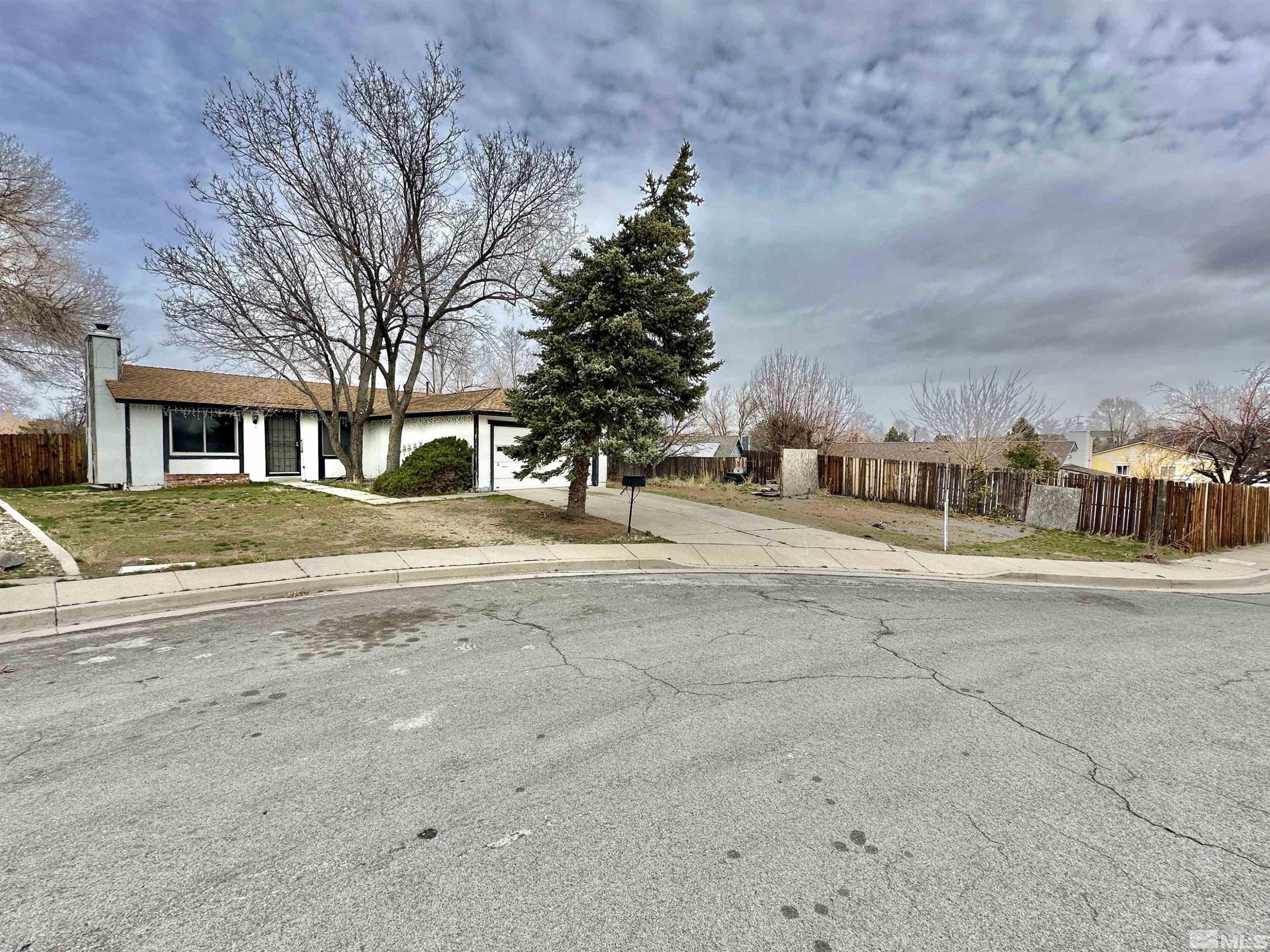 11019 Bornite Court Reno, NV 89506 - Photo 2 of 30 a view of road with building and trees