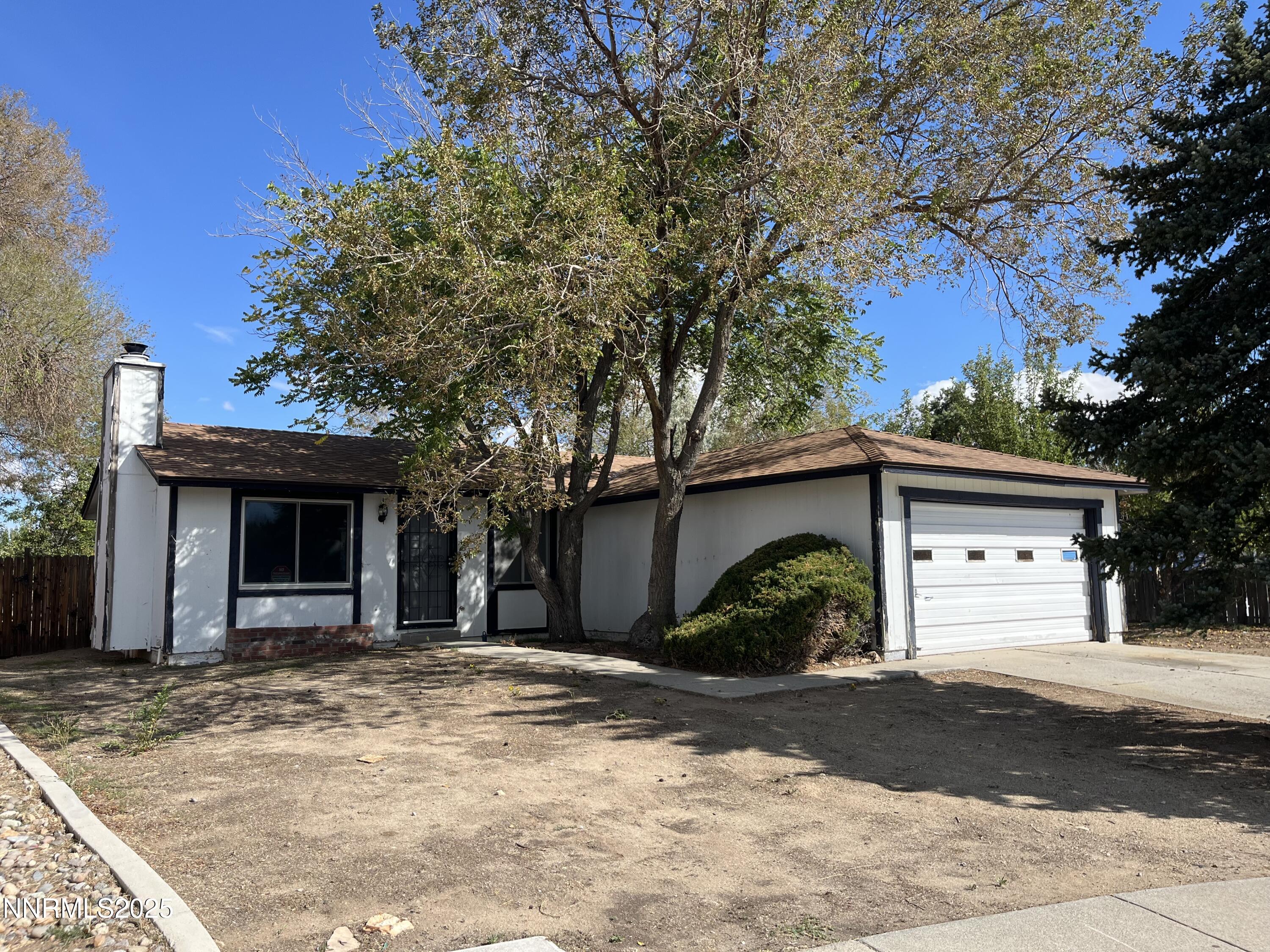 11019 Bornite Court Reno, NV 89506 - Photo 25 of 30 a view of a house with a yard and garage