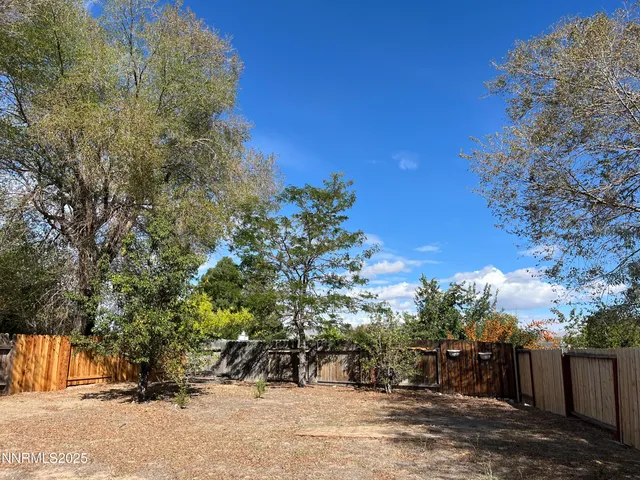 a view of a backyard of the house