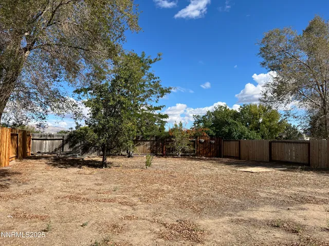 a view of a house with a tree