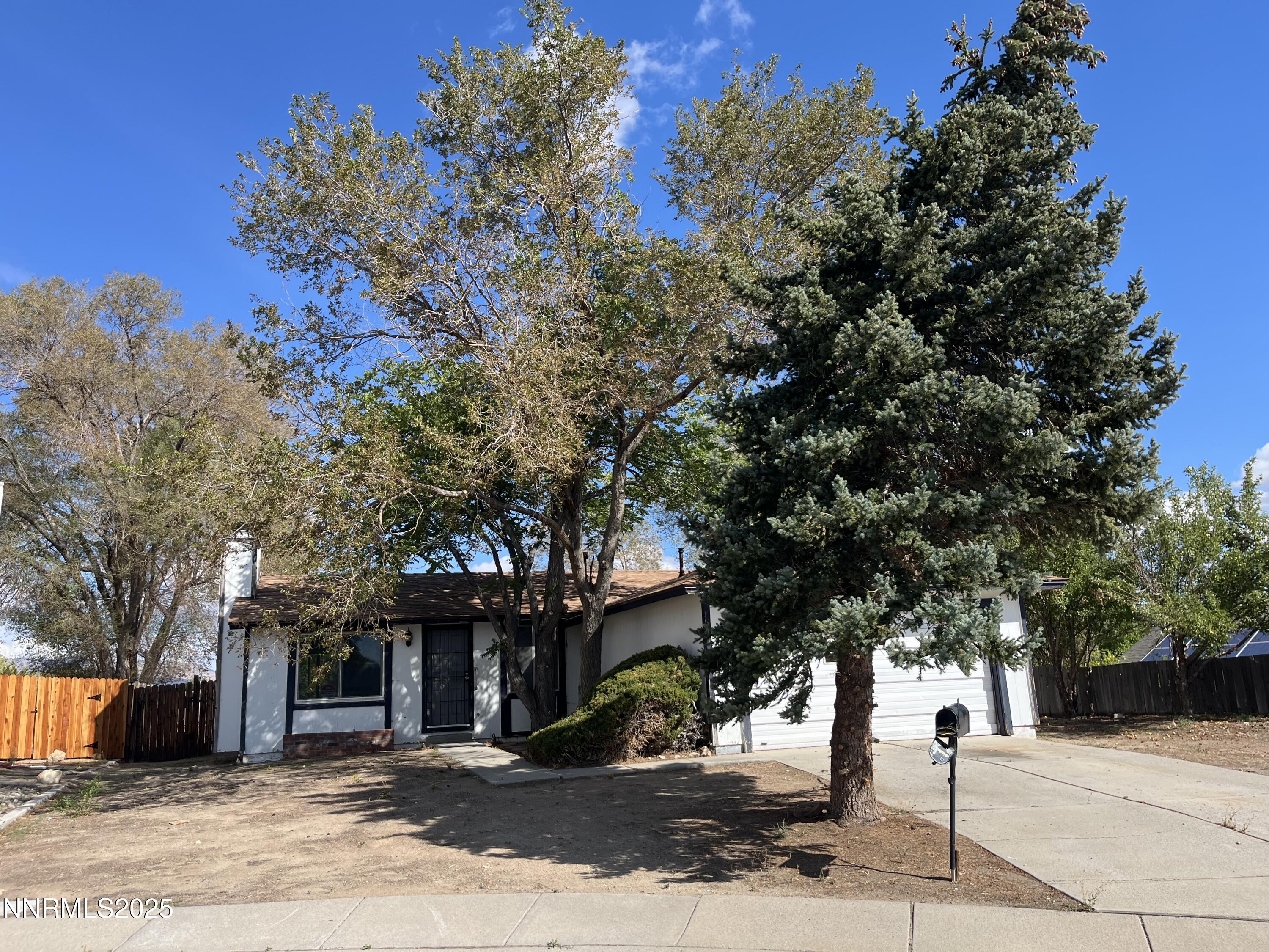 11019 Bornite Court Reno, NV 89506 - Photo 30 of 30 a front view of a house with a tree