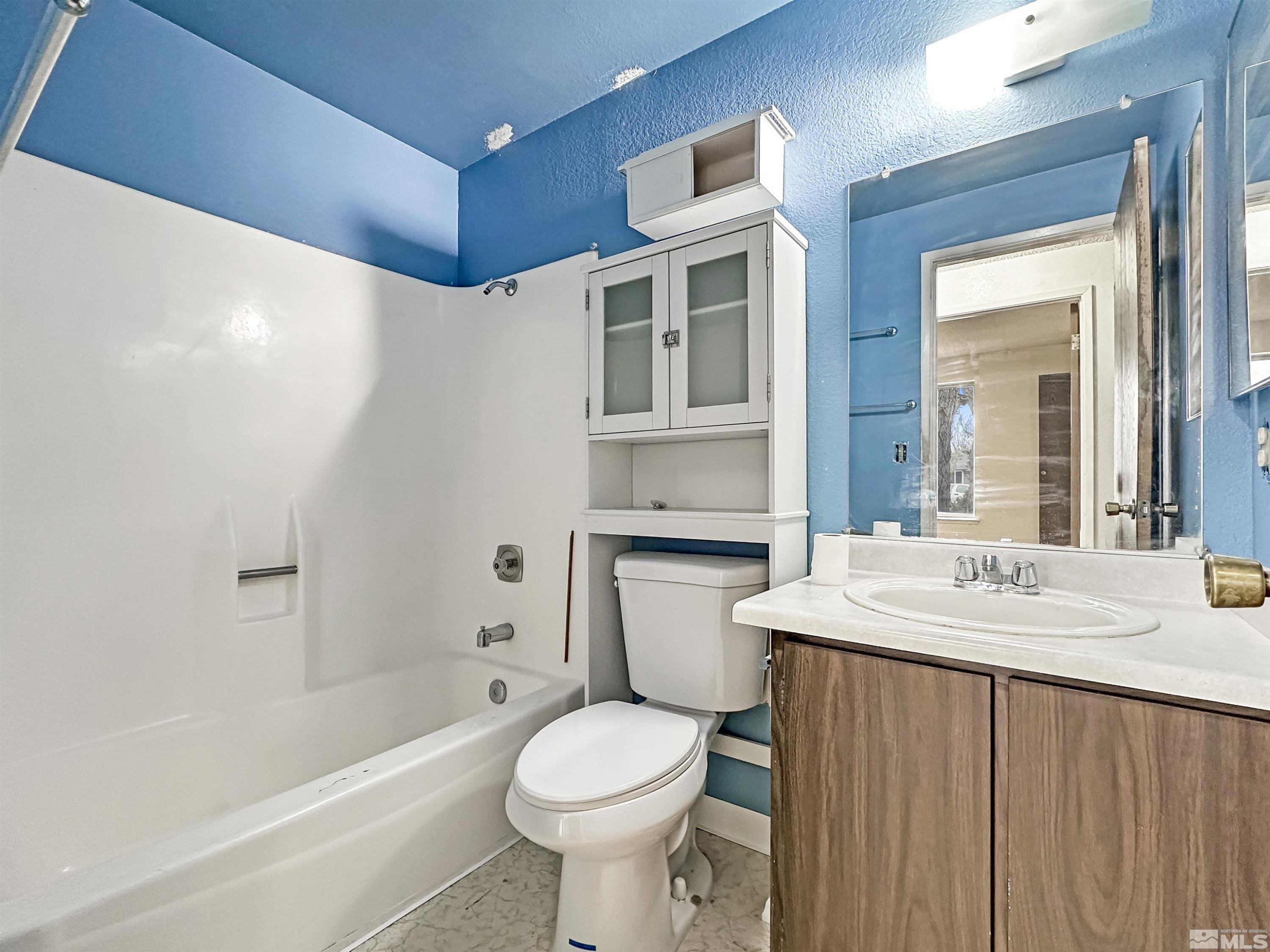 11019 Bornite Court Reno, NV 89506 - Photo 5 of 30 a bathroom with a sink toilet and shower