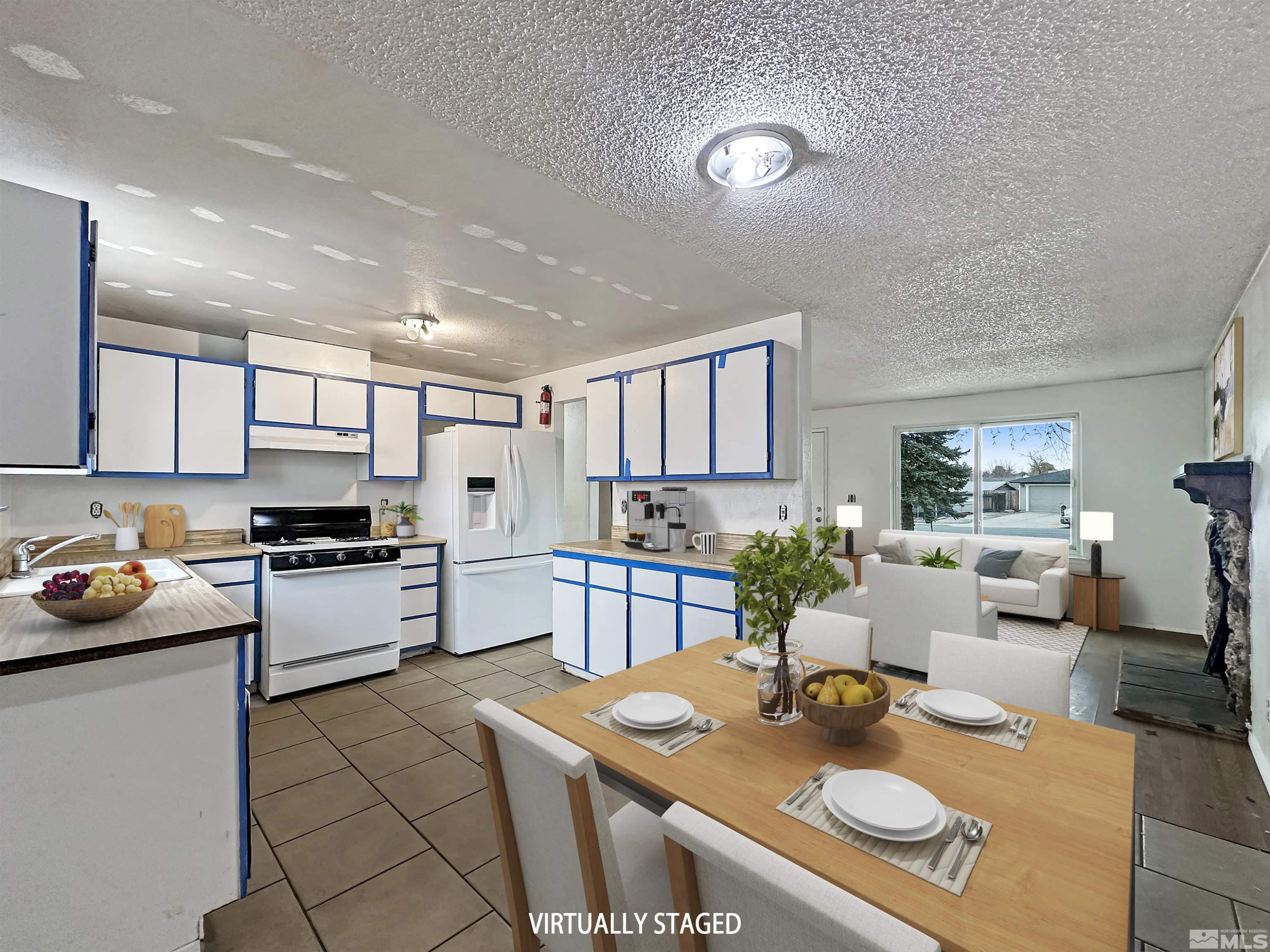 11019 Bornite Court Reno, NV 89506 - Photo 10 of 30 a kitchen with a sink stove and chairs