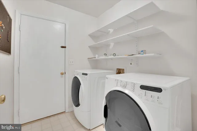 a bathroom with a shower a sink and a mirror