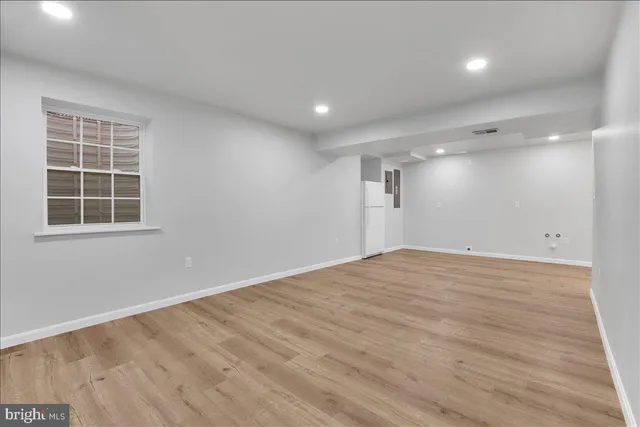 a view of an empty room with windows