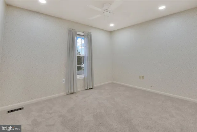 a view of a hallway with closet