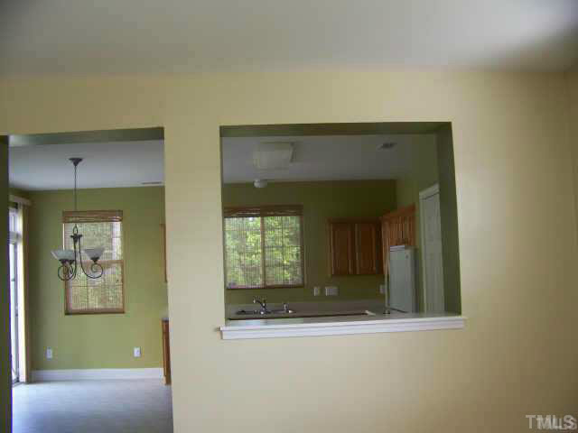 3741 Tryon Ridge Drive Raleigh, NC 27610 - Photo 2 of 6 Kitchen opens up to living room which gives the home and open feel.