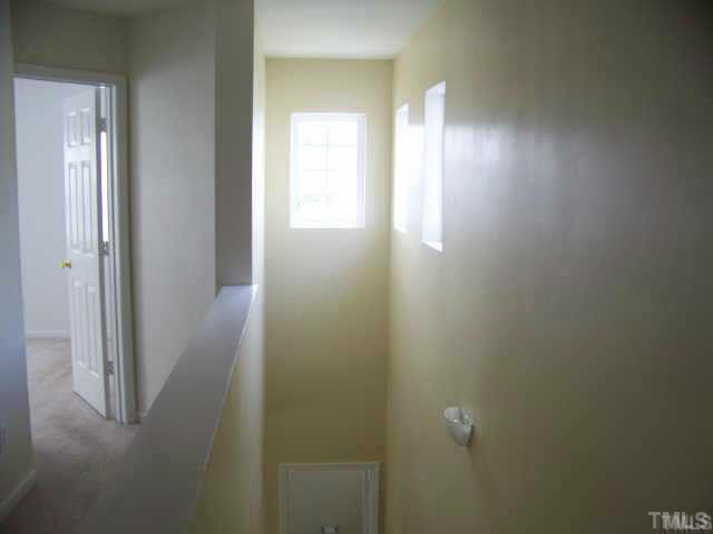 3741 Tryon Ridge Drive Raleigh, NC 27610 - Photo 4 of 6 This pictures shows the 2-story stairway which offers lots of natural sunlight.