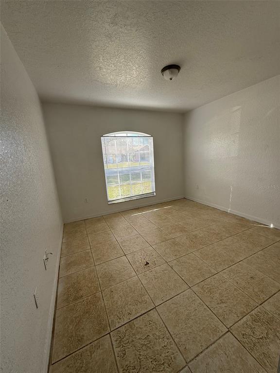 417 Francisco Way Kissimmee, FL 34758 - Photo 13 of 20 a view of an empty room with a window