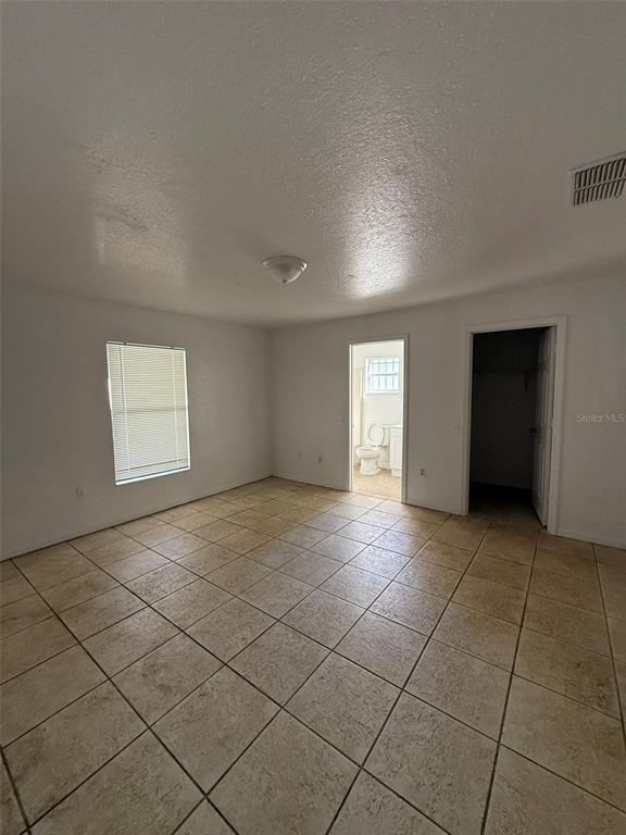 417 Francisco Way Kissimmee, FL 34758 - Photo 17 of 20 a view of an empty room and a window
