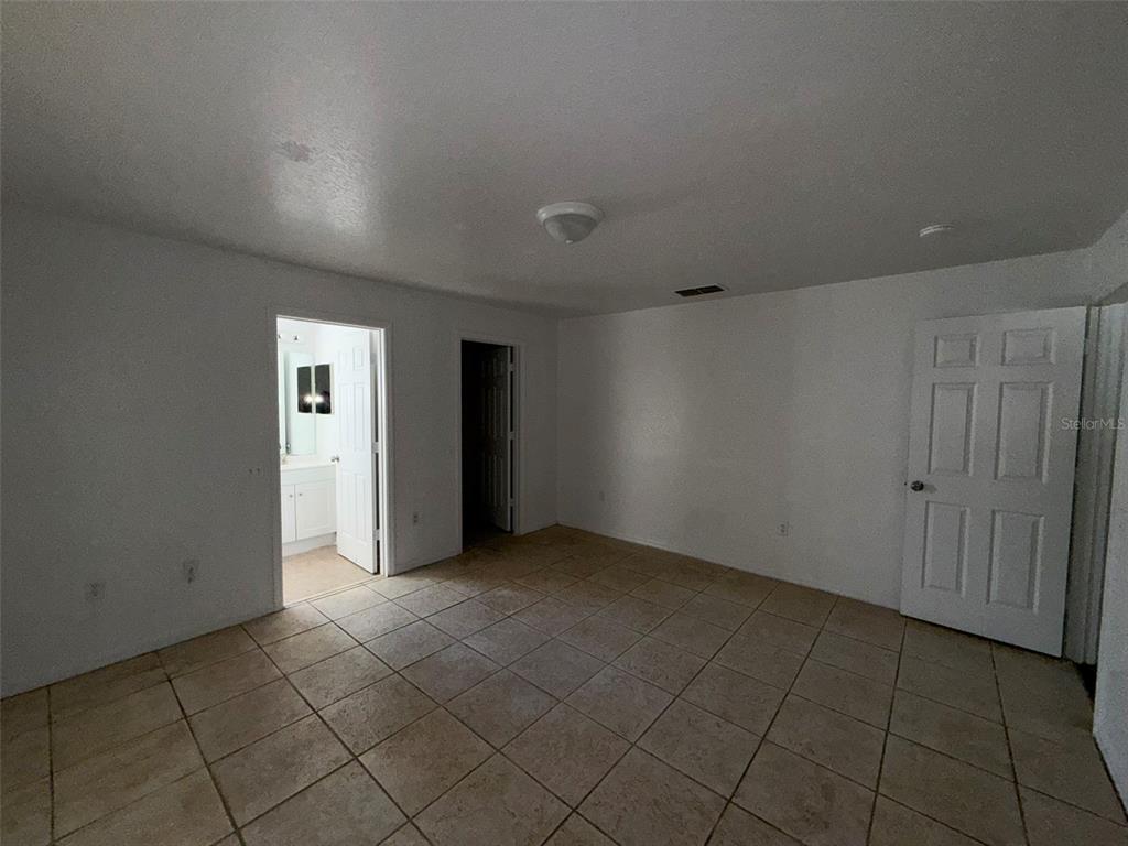 417 Francisco Way Kissimmee, FL 34758 - Photo 20 of 20 a view of an empty room and window
