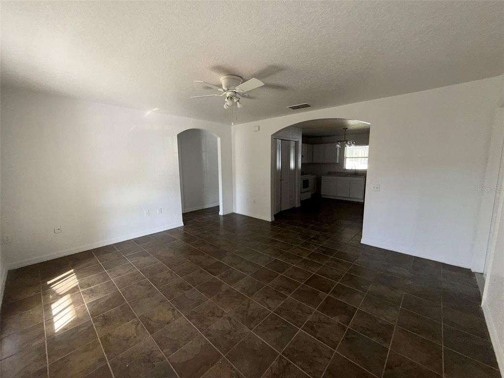 417 Francisco Way Kissimmee, FL 34758 - Photo 7 of 20 a view of a livingroom with a ceiling fan and window