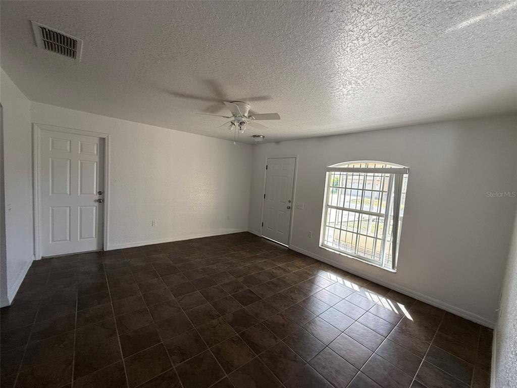 417 Francisco Way Kissimmee, FL 34758 - Photo 8 of 20 a view of an empty room with a window