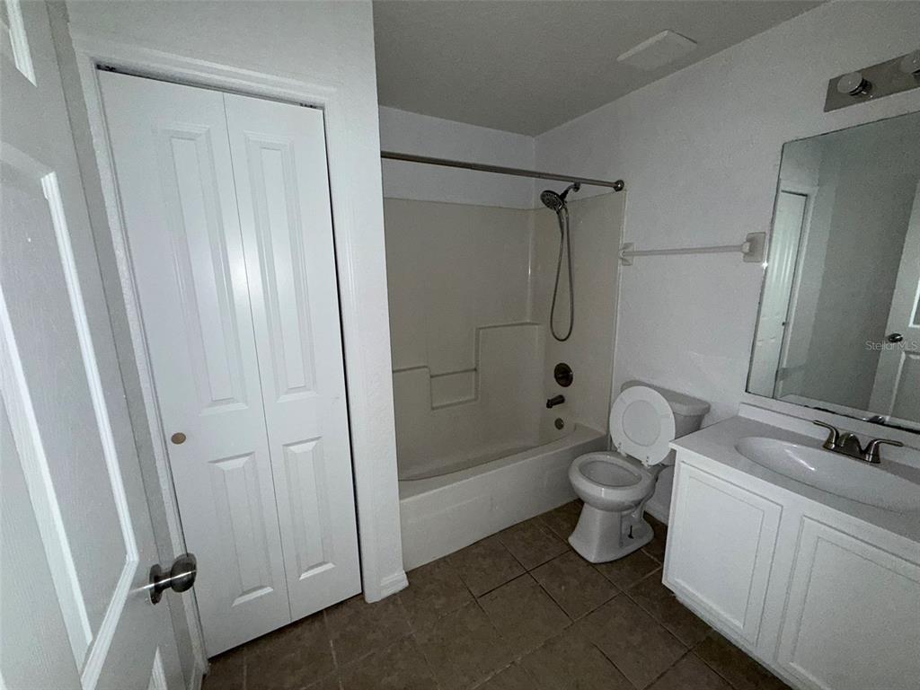 417 Francisco Way Kissimmee, FL 34758 - Photo 10 of 20 a bathroom with a toilet and a shower