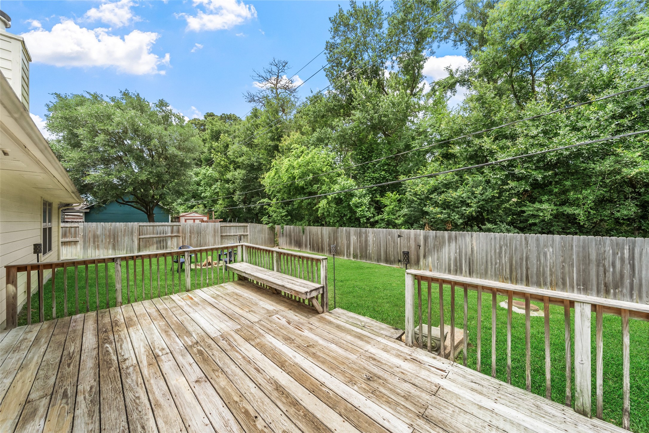 19718 Teller Boulevard Spring, TX 77388 - Photo 32 of 47 a view of deck with wooden floor and fence next to a yard