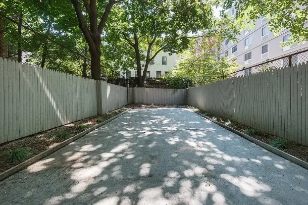 a spacious bathroom with a sink toilet and a mirror