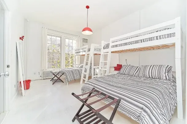 a view of empty room with windows and ceiling fan