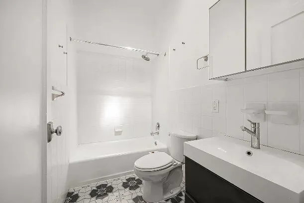 a view of a livingroom with furniture and a fireplace