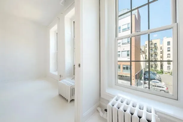 a white toilet sitting next to a bathroom sink