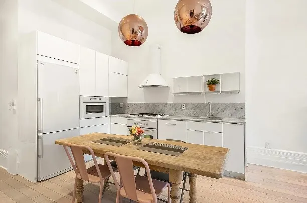 a spacious bedroom with a bed and a window