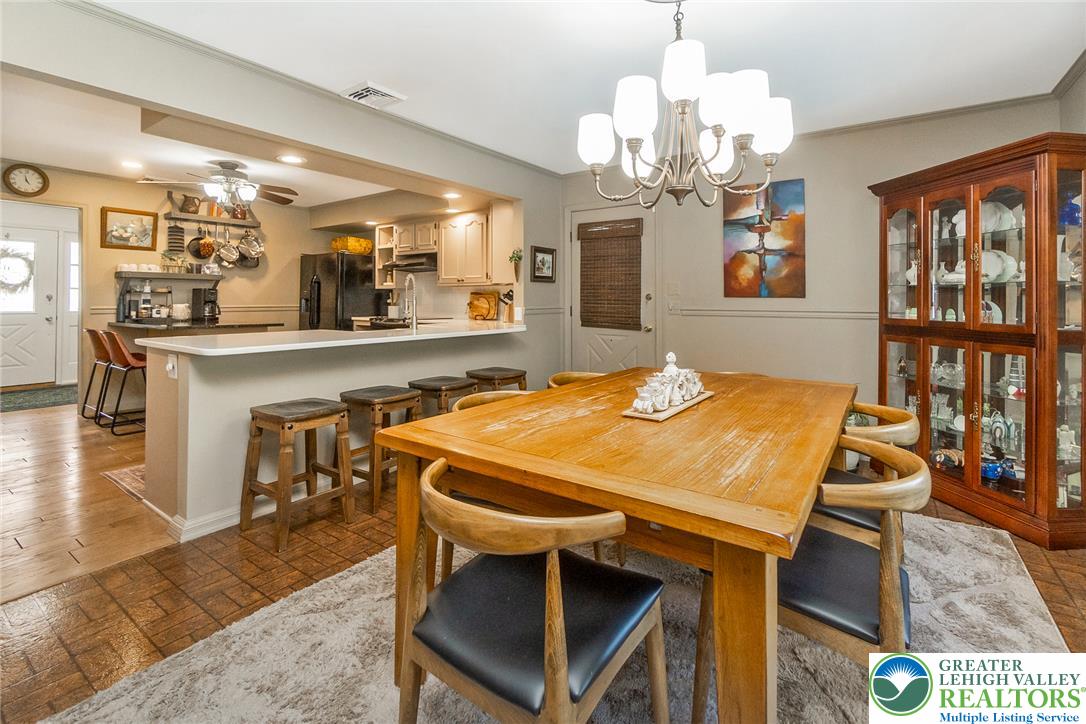 540 Briar Road Pen Argyl, PA 18072 - Photo 20 of 66 dining area flows seamlessly into a well-appointed kitchen, ideal for entertaining.