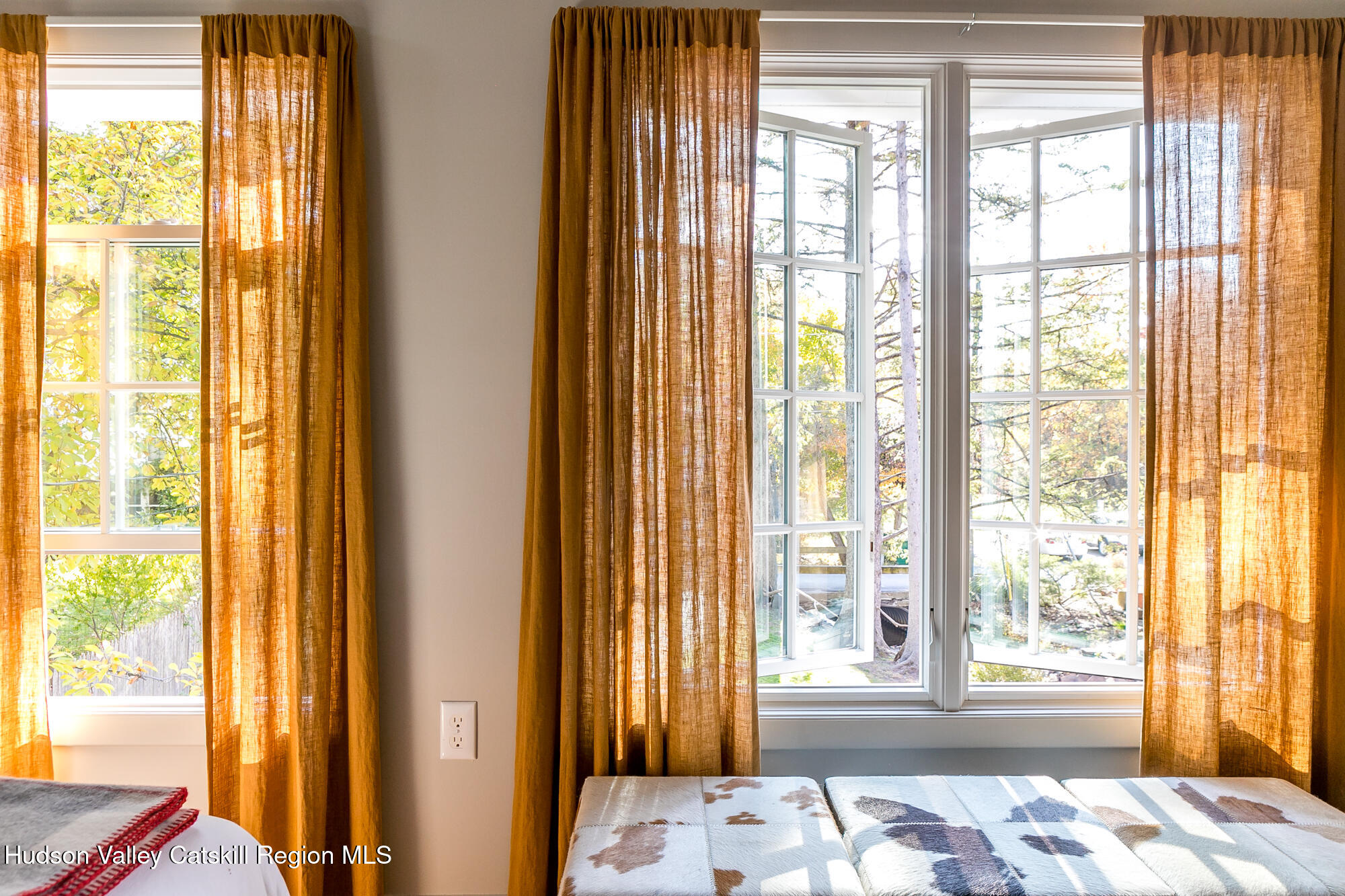 14 Old Forge Road Woodstock, NY 12498 - Photo 16 of 29 a bedroom with a bed and wooden floor next to a window
