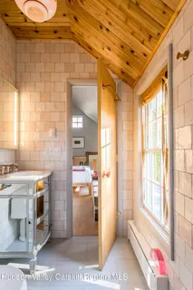 a living room with furniture and a painting