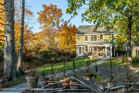 a front view of a house with garden