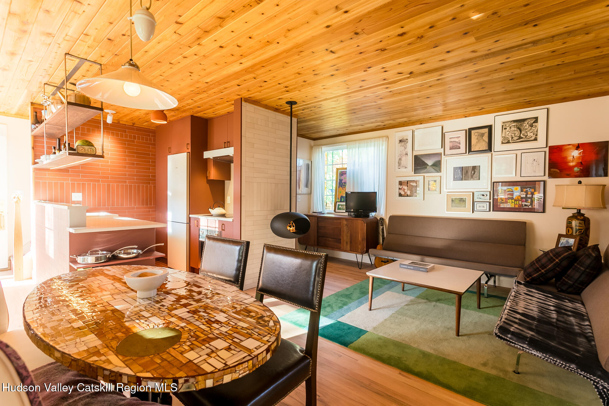 14 Old Forge Road Woodstock, NY 12498 - Photo 4 of 29 a living room with furniture a large window and wooden floor