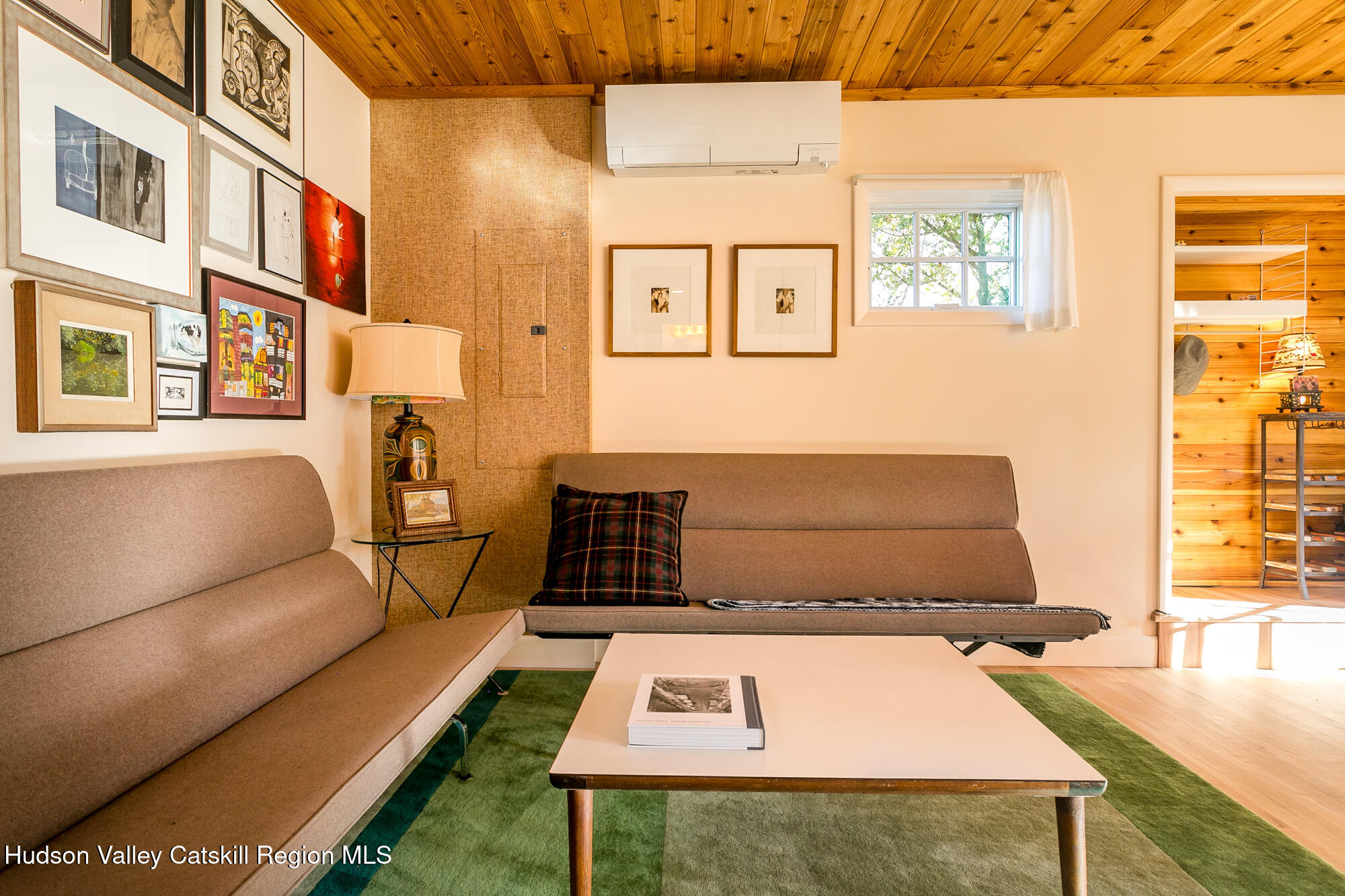 14 Old Forge Road Woodstock, NY 12498 - Photo 6 of 29 a black leather couch in a living room next to a window