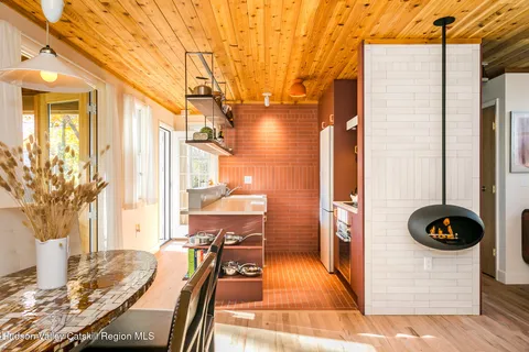 a kitchen with a refrigerator and a stove