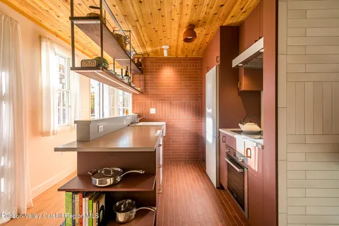 a view of a hallway with a window