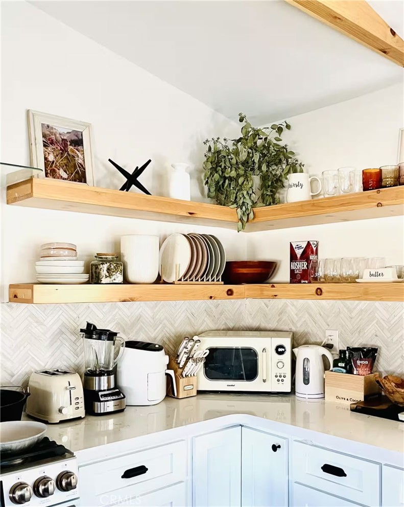 83683 Amboy Road Twentynine Palms, CA 92277 - Photo 12 of 22 a kitchen with a stove and white cabinets