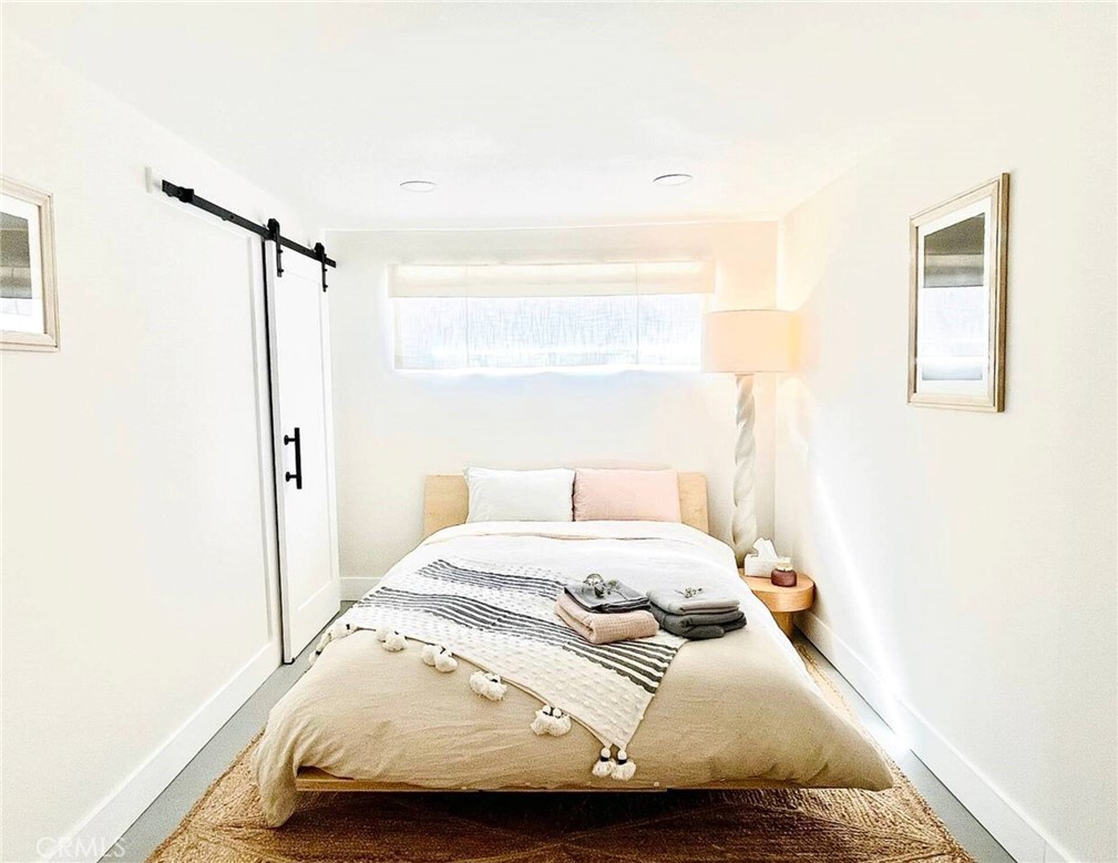 83683 Amboy Road Twentynine Palms, CA 92277 - Photo 16 of 22 a bedroom with a bed and a window