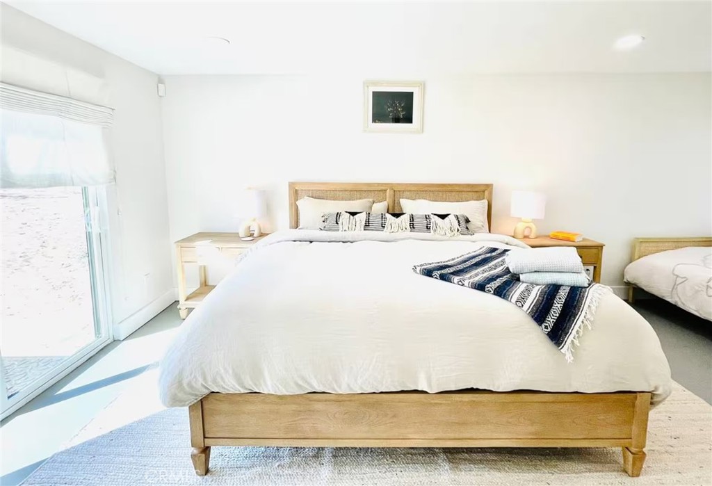 83683 Amboy Road Twentynine Palms, CA 92277 - Photo 6 of 22 a bedroom with a bed and painting on the wall