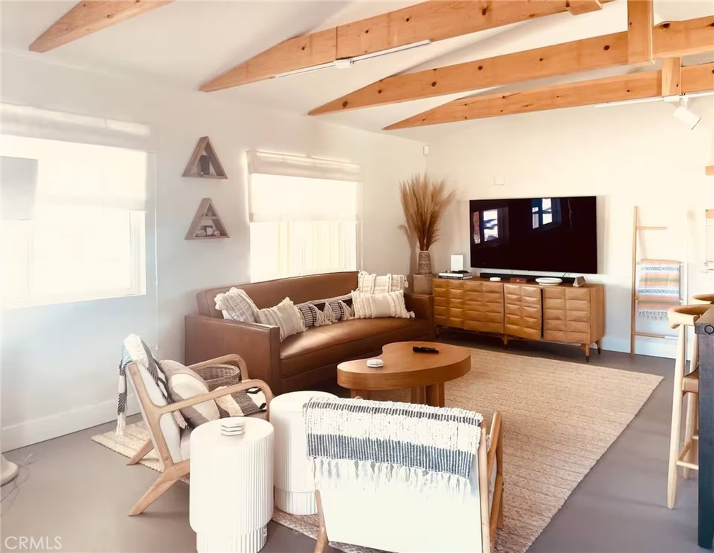 83683 Amboy Road Twentynine Palms, CA 92277 - Photo 8 of 22 a living room with furniture and a flat screen tv
