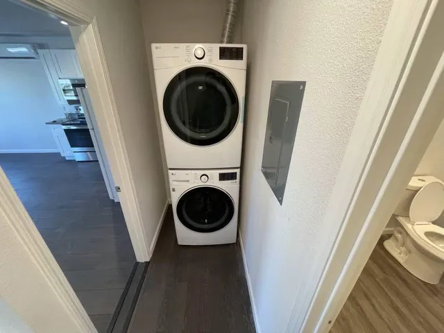 a view of a hallway with washer and dryer