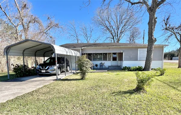 a view of a house with backyard porch and sitting area